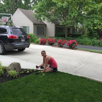 Monarch Landscape - a woman working in the front yard - Landscaping Near Me - Columbus, Ohio Monarch Landscape - a woman working in the front yard - Landscaping Near Me - Columbus, Ohio