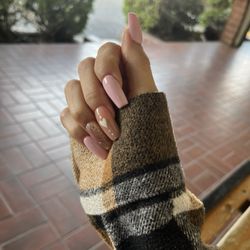 Nail Lounge - Full set with designs or gems included $70, fill $50.