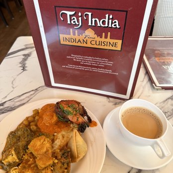 Taj India - a plate of food and a cup of coffee - Indian Near Me - Manchester, New Hampshire Taj India - a plate of food and a cup of coffee - Indian Near Me - Manchester, New Hampshire