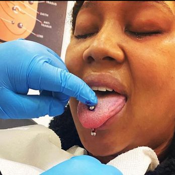 Infamous Ink Tattoos - Tongue Piercing done at Infamous Ink Tattoo in Peachtree Mall, Columbus Ga - Piercing Near Me - Columbus, Georgia Infamous Ink Tattoos - Tongue Piercing done at Infamous Ink Tattoo in Peachtree Mall, Columbus Ga - Piercing Near Me - Columbus, Georgia
