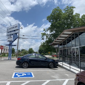 The Exceptional Bean - a car parked in a parking lot - Coffee & Tea Near Me - Cookeville, Tennessee