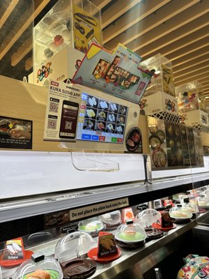 Kura Revolving Sushi Bar by null