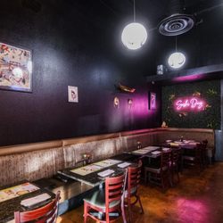 Discover a cozy dining spot where vibrant decor meets delicious sushi for a delightful experience.