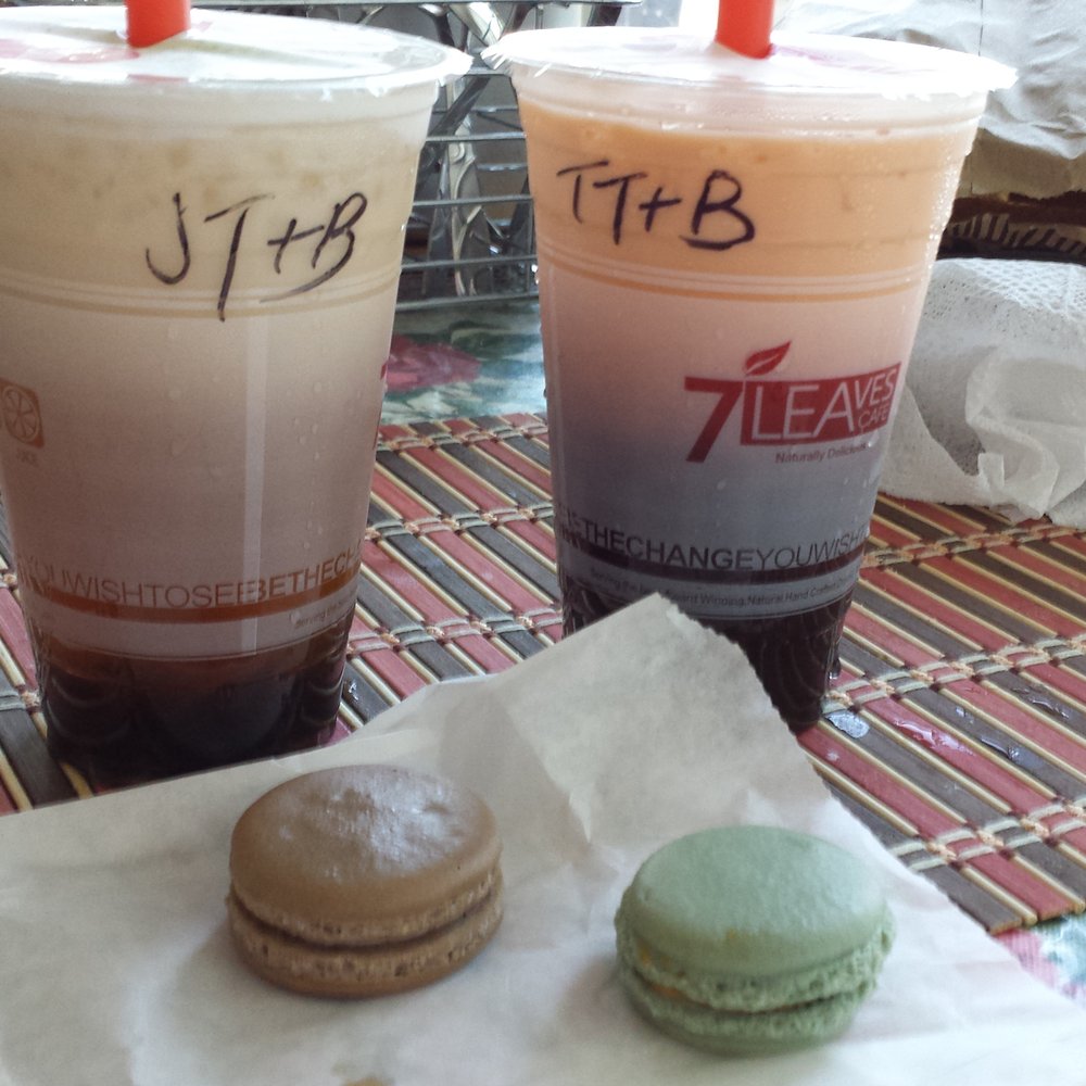 7 Leaves Cafe - Jasmine tea with boba (left), Thai tea with boba, vanilla chai macaroon (left), and salted caramel macaroon. - Coffee & Tea Near Me - Cypress, California