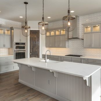 US Builders - a kitchen with stainless steel appliances - General Contractors Near Me US Builders - a kitchen with stainless steel appliances - General Contractors Near Me