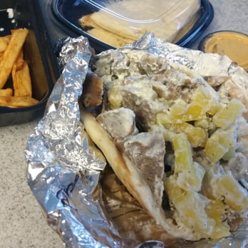 Gyroville - Gyro on a pita with pineapple and feta cheese, free humus and pita for checking in with yelp and yummy fries. - Greek Near Me - Miami, Florida