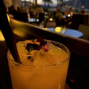 Jade Bar - a glass of orange juice with a flower garnish - Lounges Near Me - Paradise Valley, Arizona Jade Bar - a glass of orange juice with a flower garnish - Lounges Near Me - Paradise Valley, Arizona