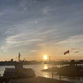 The Wooden Monkey - Bridge, ferry, Canadian flag and sunset from the patio - Gluten-Free Near Me - Dartmouth, Nova Scotia The Wooden Monkey - Bridge, ferry, Canadian flag and sunset from the patio - Gluten-Free Near Me - Dartmouth, Nova Scotia