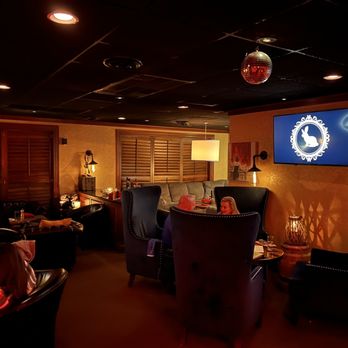 Black Rabbit - people sitting at tables in a dimly lit restaurant - Lounges Near Me - Louisville, Kentucky
