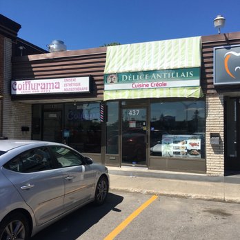 Délice Antillais - a car parked in front of a restaurant - Cajun/Creole Near Me - Laval, Quebec