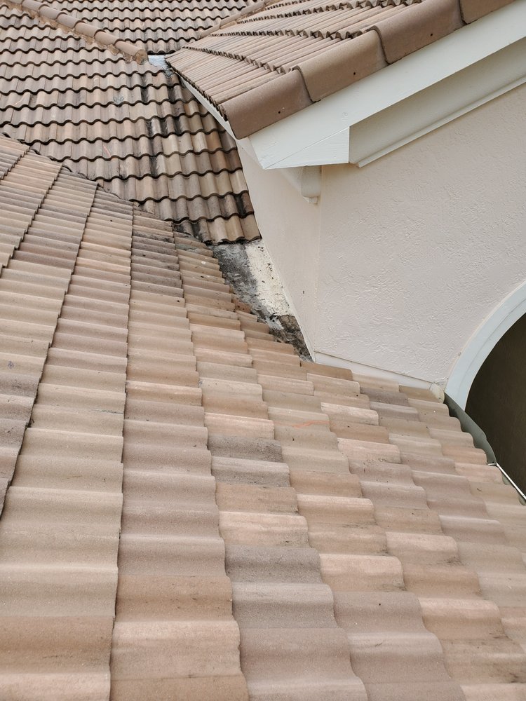 Slide of Rip Tide Roofing