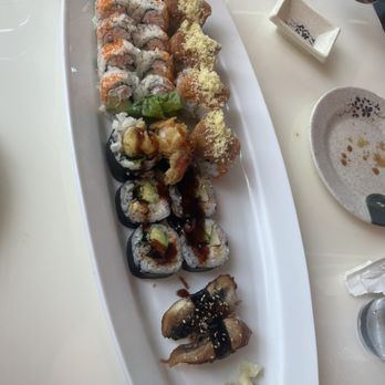 Blue Fin Sushi Bar & Restaurant - (Left to right top to bottom) California Roll, Spicy Girl Roll, Shrimp Tempura Roll, Unagi Nigiri - Sushi Bars Near Me - Denver, Colorado Blue Fin Sushi Bar & Restaurant - (Left to right top to bottom) California Roll, Spicy Girl Roll, Shrimp Tempura Roll, Unagi Nigiri - Sushi Bars Near Me - Denver, Colorado