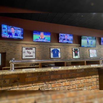 Half Wall – Port Orange - a brick bar with tvs on the wall - Sports Bars Near Me - Port Orange, Florida Half Wall – Port Orange - a brick bar with tvs on the wall - Sports Bars Near Me - Port Orange, Florida