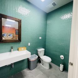 The Perfect Laundromat - Clean bathroom with modern finishes for comfort while doing your self-service laundry. #Bushwick