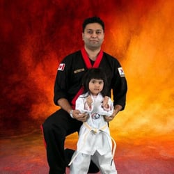 Richmond Martial Arts - Owner Johnny Ahmed and his 3 year old daughter