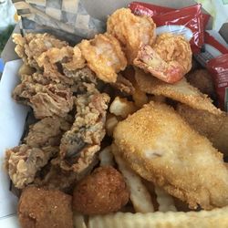 Fish, shrimp, oysters, hush puppies and fries