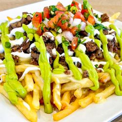 Westwind Bar and Grill - Carner Asada French Fries, cooked to order shoe string french fries, topped with steak, pico de gallo (diced cilantro, tomato and onions).