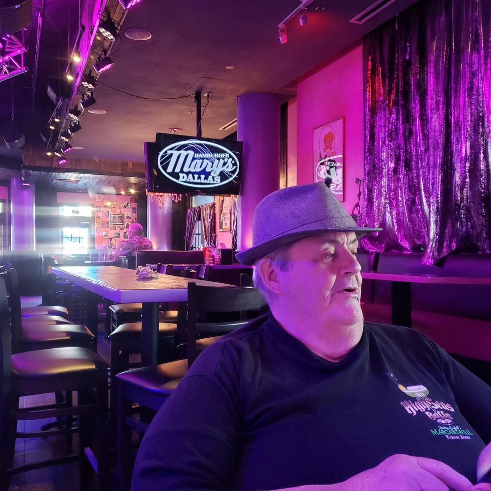 Hamburger Marys - A shot of my hubby and the Hambuger Mary sign! - Cabaret Near Me - Dallas, Texas