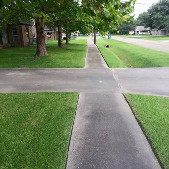 Caldwell Lawn Works - a paved sidewalk with a tree in the background - Landscaping Near Me Caldwell Lawn Works - a paved sidewalk with a tree in the background - Landscaping Near Me