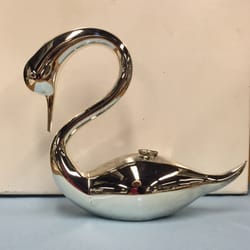 A spray chromed (silver mirrored) blown glass swan.