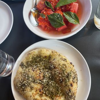 Rolo's - Watermelon salad and sesame oregano polenta bread - Sandwiches Near Me - Ridgewood, New York Rolo's - Watermelon salad and sesame oregano polenta bread - Sandwiches Near Me - Ridgewood, New York