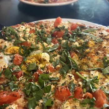 Padrino - Foxy Shazam in front and individual pizza ordered with meat toppings. - Pizza Near Me - Milford, Ohio