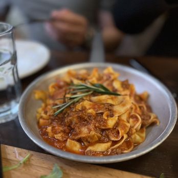 Maestro Pasta - a plate of pasta on a table - Italian Near Me - New York, New York Maestro Pasta - a plate of pasta on a table - Italian Near Me - New York, New York