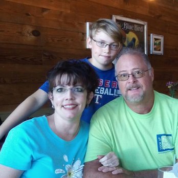 Mence Farms - a family sitting at a table - Honey Near Me - Sherman, Texas Mence Farms - a family sitting at a table - Honey Near Me - Sherman, Texas