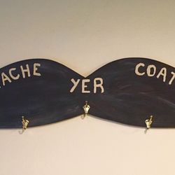 'STACHE YER COATS' on our custom made coat rack