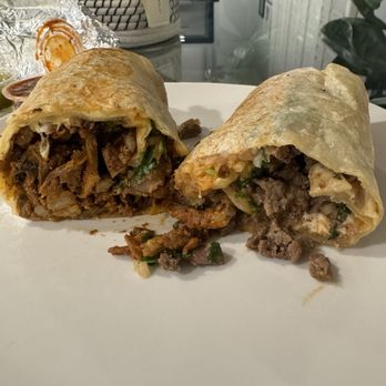 Tacos Garcia - Al pastor to the left. Carne asada to the right. Both very good but al pastor is my fav. So good here - Mexican Near Me - Orange, California