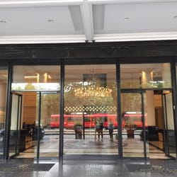 Diplomatic Hotel - Outside of front doors looking into the lobby.  Great service by front doormen.