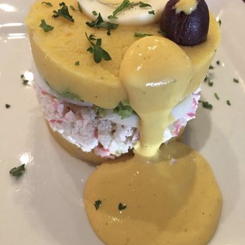 El Chullo Peruvian Restaurant & Bar - CAUSA DE CANGREJO Layered mashed potatoes seasoned with yellow pepper & lime juice filled with avocado, hard-boiled eggs & crab filling. - Peruvian Near Me - Phoenix, Arizona El Chullo Peruvian Restaurant & Bar - CAUSA DE CANGREJO Layered mashed potatoes seasoned with yellow pepper & lime juice filled with avocado, hard-boiled eggs & crab filling. - Peruvian Near Me - Phoenix, Arizona