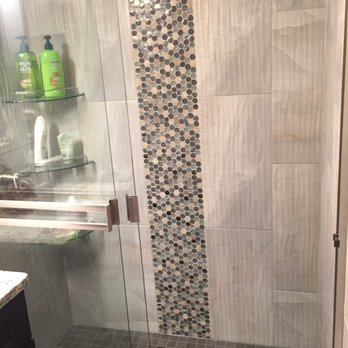 Mega Kitchen And Bath - This is the main bathroom with vertical tiles and 3 shelves. The accent tiles are the same as the other bathroom but those are horizontal. - General Contractors Near Me - Silver Spring, Maryland