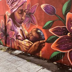 International Woman murals - Mom watching sleeping baby