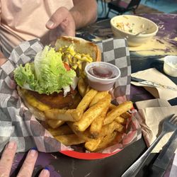 Goofy's Bar and Grill - A burger with a slab of pork belly and fries.