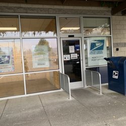 USPS - Post office, mailing drop box by the exit door.