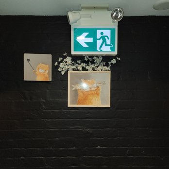 Shibui Eatery + Sushi Bar - a bathroom with a black brick wall - Sushi Bars Near Me - Toronto, Ontario Shibui Eatery + Sushi Bar - a bathroom with a black brick wall - Sushi Bars Near Me - Toronto, Ontario