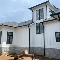 Prices Gutters & Construction - 7" inch Quarter round gutters and 4" inch round downspouts.