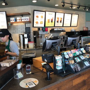 Starbucks - a man working behind a counter in a coffee shop - Coffee & Tea Near Me - Roswell, Georgia Starbucks - a man working behind a counter in a coffee shop - Coffee & Tea Near Me - Roswell, Georgia