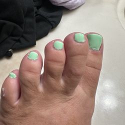 Q Nails - Messy pedi, worse I've EVER had and this is AFTER I ask him to clean them up!!