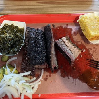 Cattleack Barbeque - 1 pork rib on the left and 1.2 pounds of fatty brisket - Barbeque Near Me - Dallas, Texas Cattleack Barbeque - 1 pork rib on the left and 1.2 pounds of fatty brisket - Barbeque Near Me - Dallas, Texas