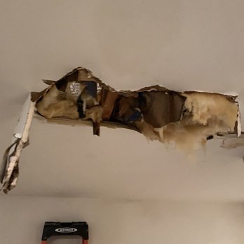 Big T Moving & Delivery - My ceiling inside the garage where the water collected all day from the leaking refrigerator line that was damaged during the disconnect - Movers Near Me - Alpharetta, Georgia