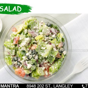 Pizza Mantra - a salad in a bowl with a fork - Pizza Near Me - Langley, British Columbia Pizza Mantra - a salad in a bowl with a fork - Pizza Near Me - Langley, British Columbia
