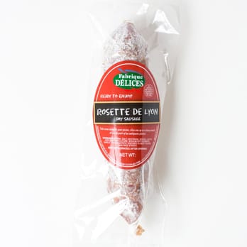 Fabrique Delices - Rosette de Lyon Dry Sausage: Made from blended pork meat with fresh garlic, sea salt and black peppercorn. Cured 30 days and then hand tied. - Meat Shops Near Me - Hayward, California Fabrique Delices - Rosette de Lyon Dry Sausage: Made from blended pork meat with fresh garlic, sea salt and black peppercorn. Cured 30 days and then hand tied. - Meat Shops Near Me - Hayward, California
