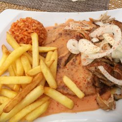 Restaurant Rhodos - Nr. 121 - - "Grillteller" : 2 Schweinesteaks, Suzukia, Gyros, Metaxasauce, Pommes, Reis und Salat.