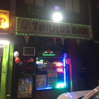 Tarros Bar - the front of a restaurant at night - Bars Near Me - Corona, New York