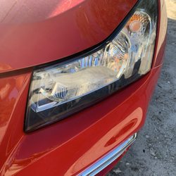Tropical Paint & Body Shop - A gap between the hood and the light  from the left side