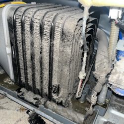 Good Guy Appliance Service - Dirty condenser coils on a refrigerator ( needs cleaning asap )