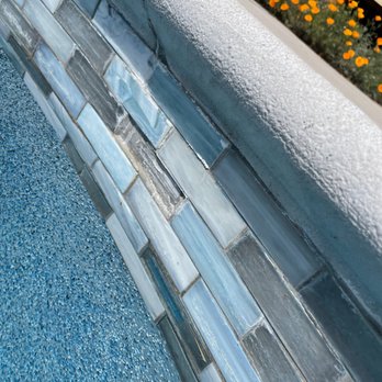 No Problem Pools - a closeup of the edge of a swimming pool - General Contractors Near Me - San Jose, California No Problem Pools - a closeup of the edge of a swimming pool - General Contractors Near Me - San Jose, California