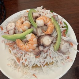 Tostada mixta (shrimp, pulpo, jaiba, fish ceviche)